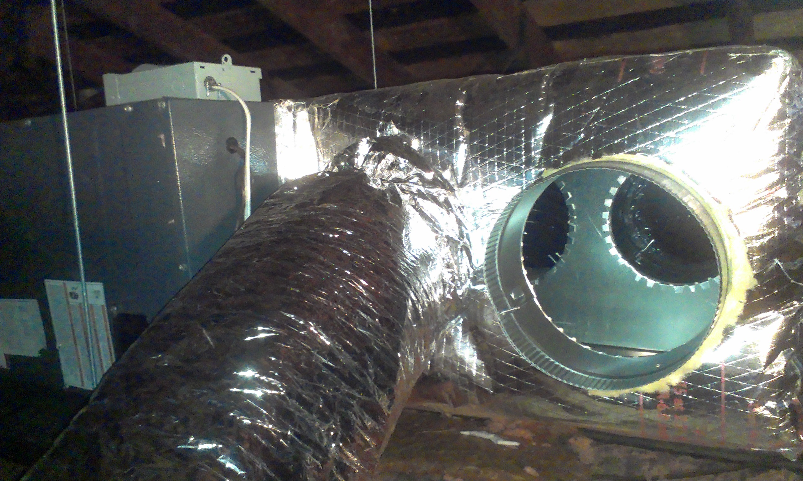 Attic mounted system being installed. No insulation inside the ducts! All exterior insulated R8