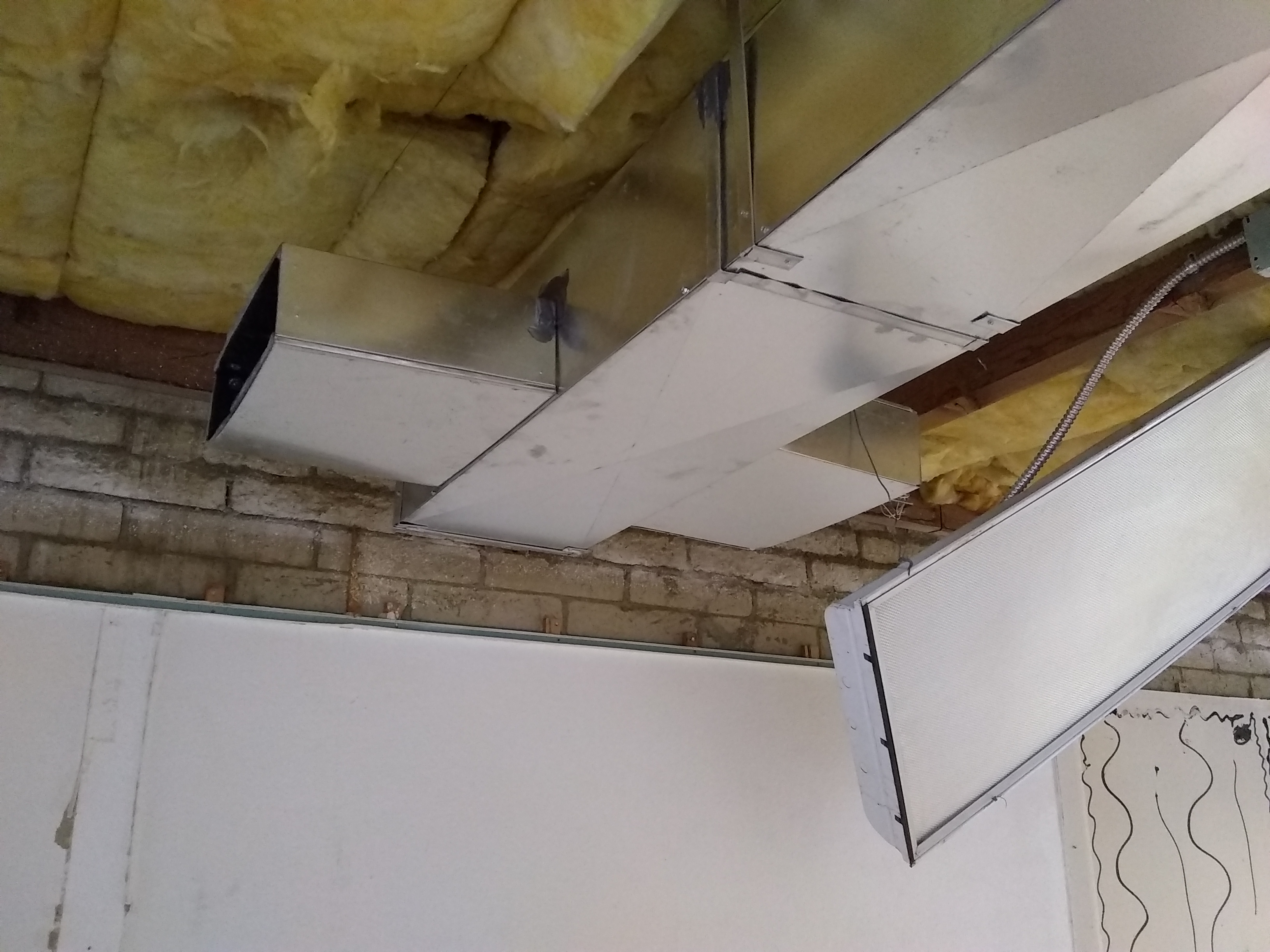 Metal ducting being installed during office remodel